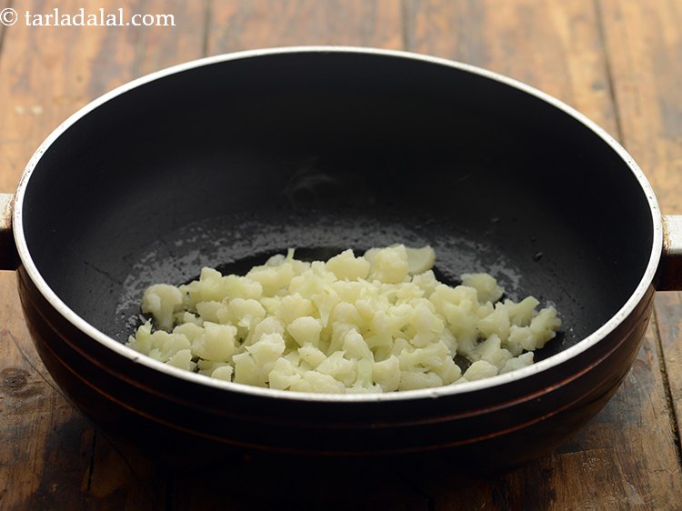 Step 27 – Add the cauliflower. We have chopped them into florets and also blanched them prior to …