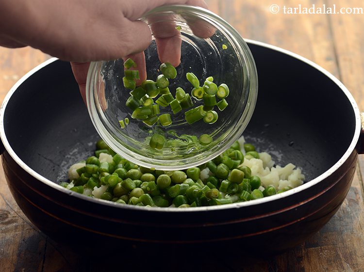 Step 29 – Add the chopped and blanched french beans.