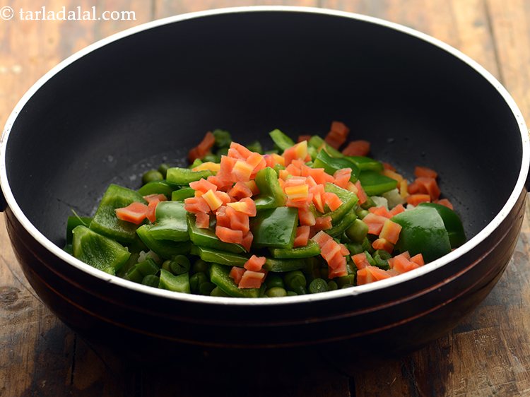 Step 31 – Add chopped and blanched carrots.