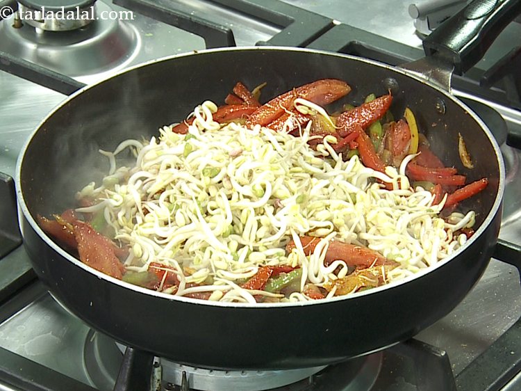 Step 15 – Add the bean sprouts. This adds crunch to the stuffing.&nbsp;