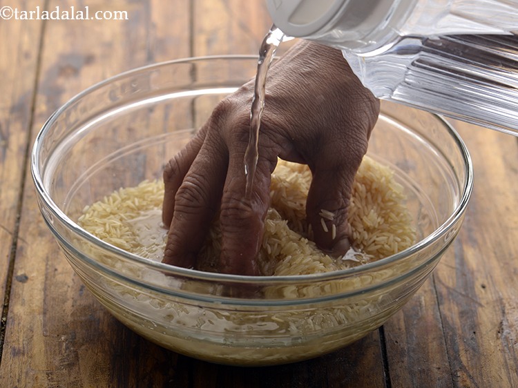 Step 2 – For the <strong>Vegetable Panchmel Khichdi</strong>, clean the rice &amp; put in a strainer. Wash the …