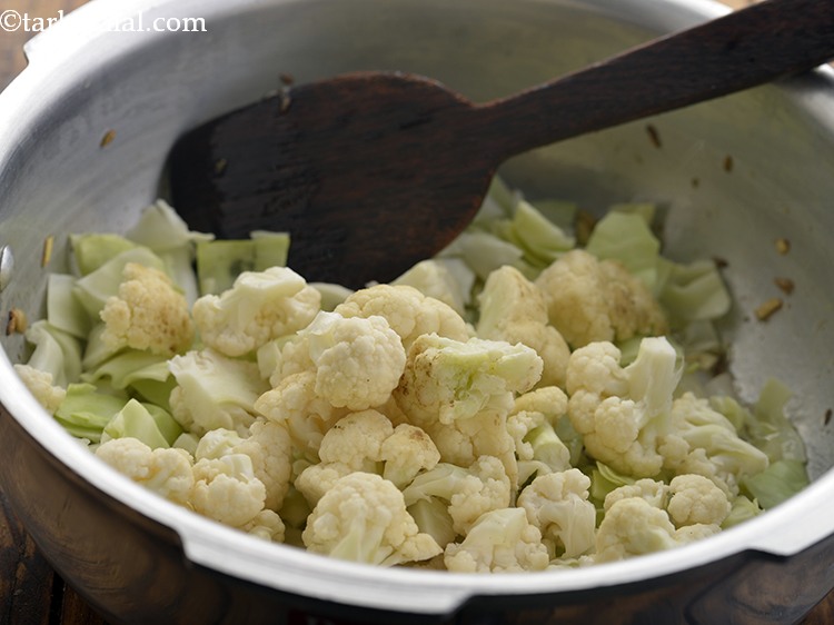 Step 16 – Add the cauliflower. Add whichever vegetables you like or are easily available.