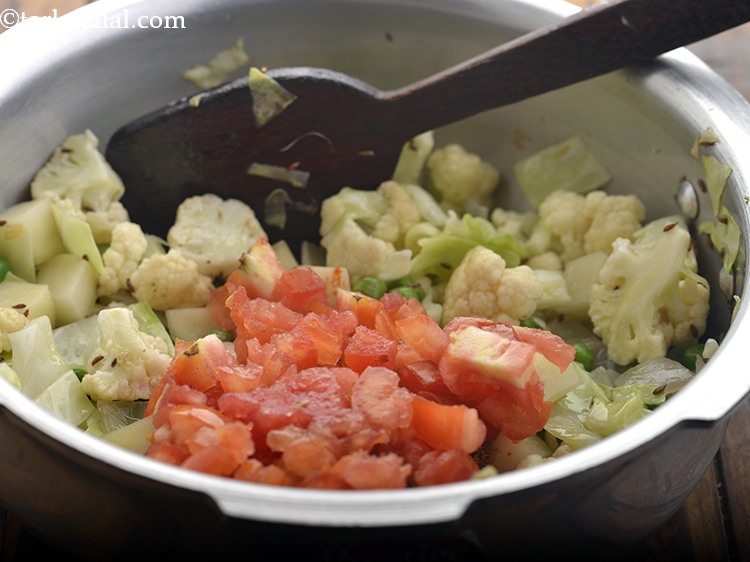 Step 22 – Add the tomatoes.