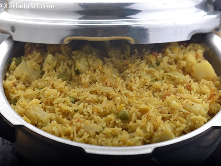 Step 25 – Allow the steam to escape naturally before opening the lid. Mix once. Also, at this …