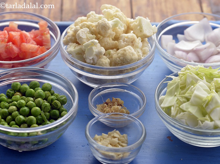 Step 9 – Meanwhile, wash the vegetables and peel skin from onion, potato.Chop all vegetables measure and keep …