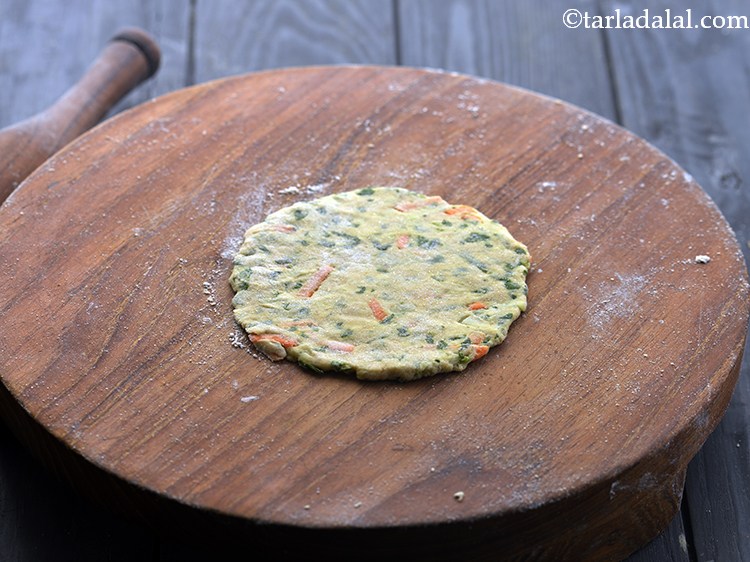 Step 13 – Roll each portion into a 75 mm. (3&quot;) diameter circle using a little whole wheat …