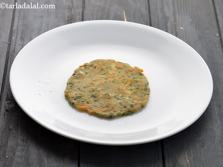 Step 16 – Remove the <strong>Vegetable Parathas for Babies</strong> in a plate. Similarly, cook rest of the vegetable …