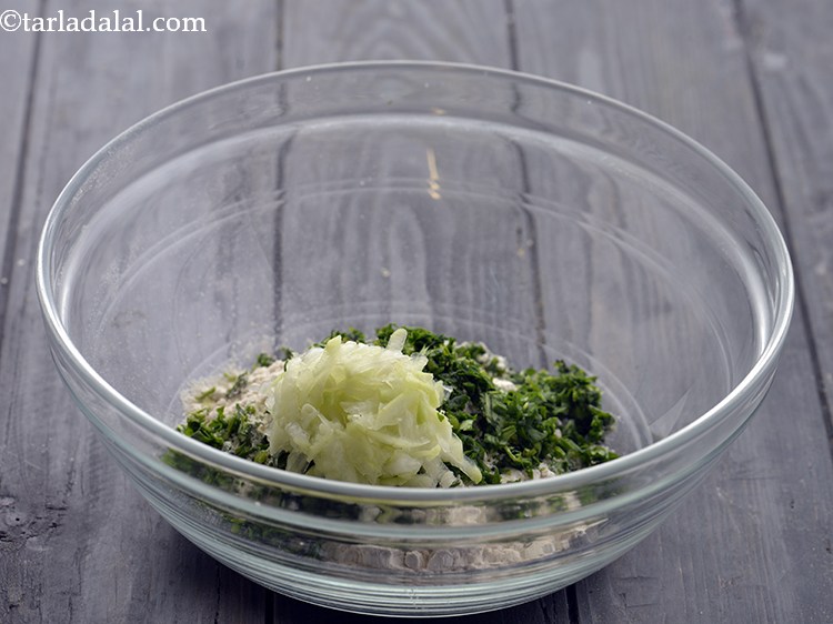 Step 4 – Add the grated bottle gourd. This helps in binding the dough because the good amount …