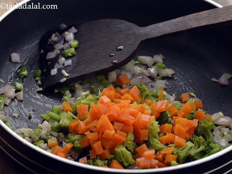 Step 20 – Add the carrot. Also, you can add peas, french beans, baby corn, zucchini and mushroom …