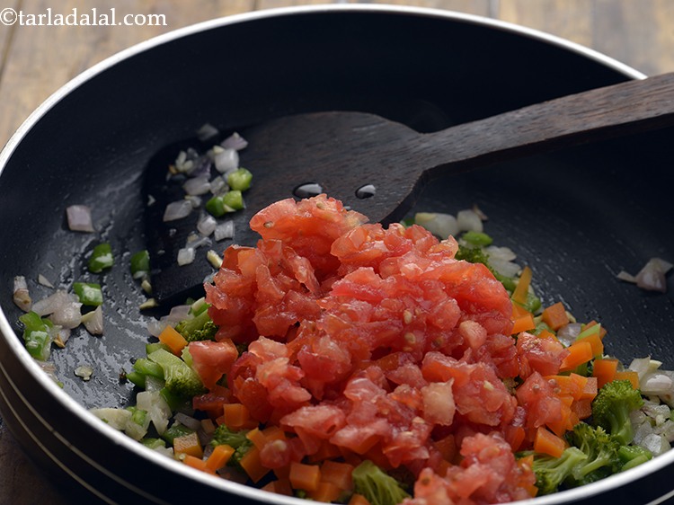 Step 21 – Add tomatoes. It provides a tang to the pasta dish.