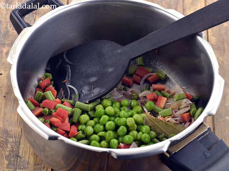 Step 13 – Now, add the green peas.