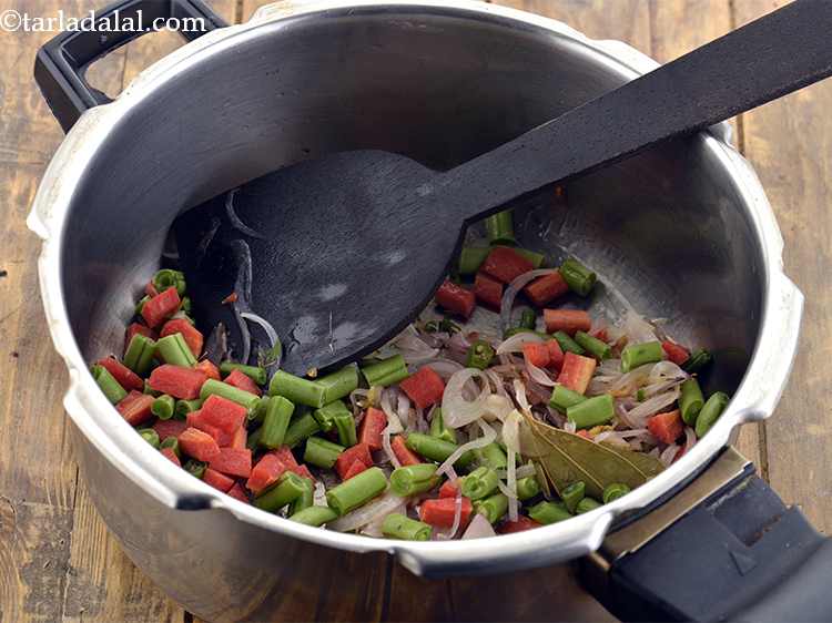 Step 12 – Add the chopped French beans and carrots. You can use any vegetables of your choice …