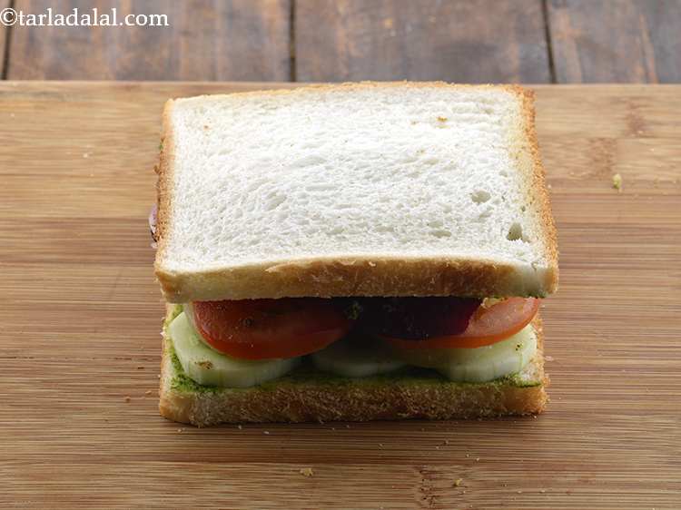 Step 30 – Cover it with another slice of bread, with the buttered-chutney side facing downwards.
