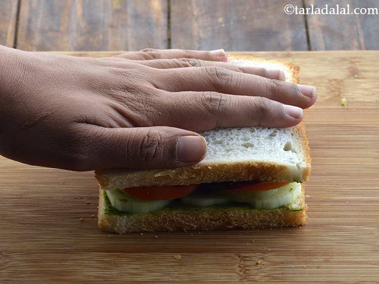 Step 31 – Press the&nbsp;<strong>Vegetable Sandwich</strong>&nbsp;lightly with your hands.&nbsp;