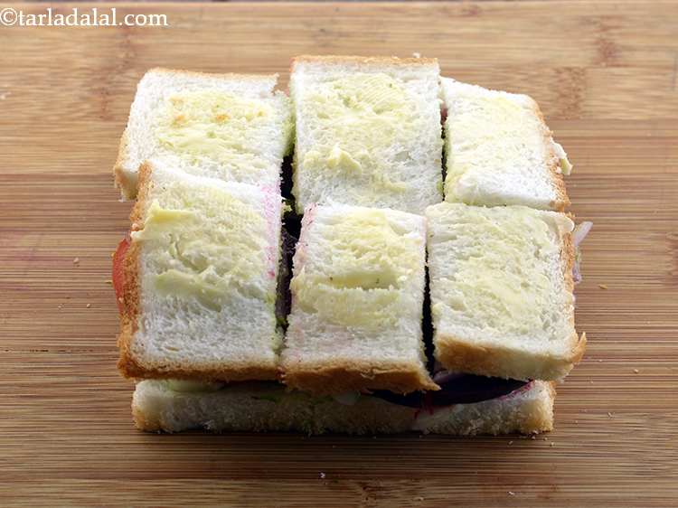 Step 33 – Apply 1/2 tsp of butter evenly over the&nbsp;<strong>Vegetable Sandwich</strong>. This gives a very nice flavour …