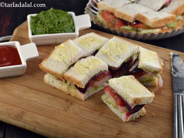 Step 35 – Serve this <strong>Vegetable Sandwich</strong> immediately with <a href="https://www.tarladalal.com/Tomato-Ketchup-Tomato-Sauce-Homemade-Tomato-Ketchup-40725r">tomato ketchup</a> and green chutney.