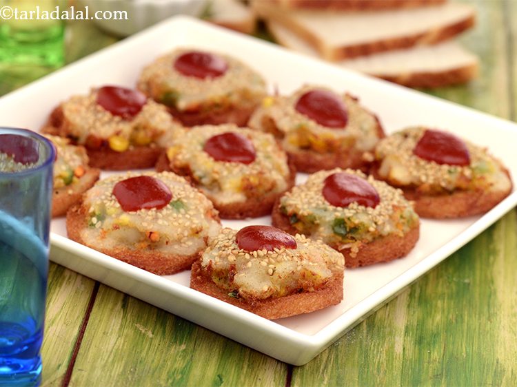 Step 27 – Serve the <strong>Vegetable Gold Coins</strong> immediately with red chilli sauce.