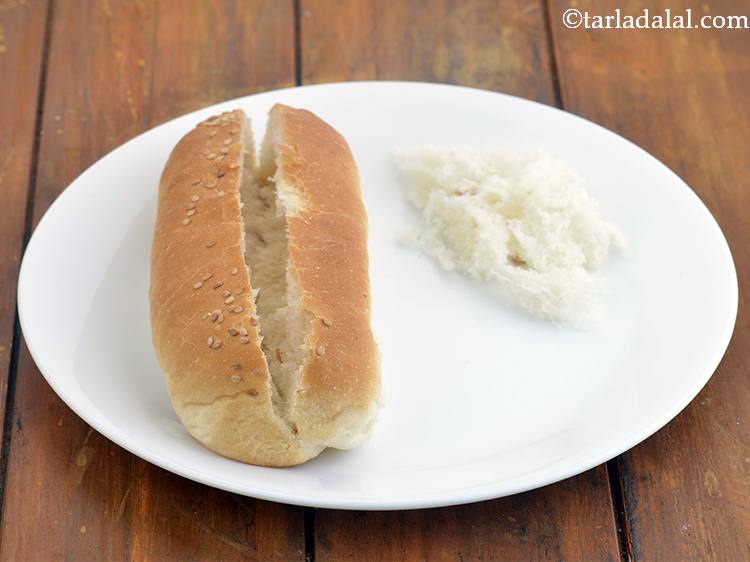 Step 26 – Slit a hot dog roll from top and lightly scoop out the centre using your …