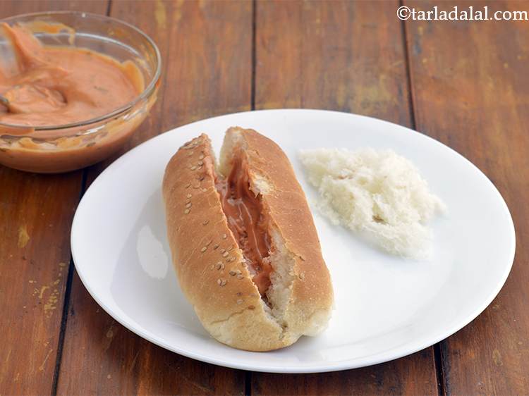 Step 27 – Spread 1 tbsp of the prepared mayo-chilli sauce evenly in the cavity. You can increase …