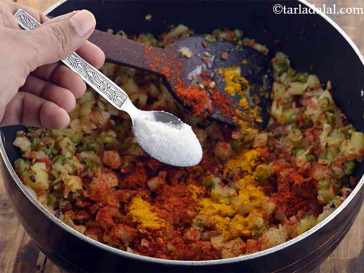 Step 9 – Add the turmeric powder and salt.