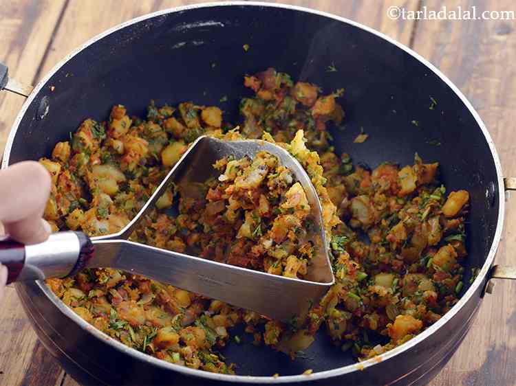 Step 13 – While the mixture is yet hot, mash it lightly using a potato masher to a …