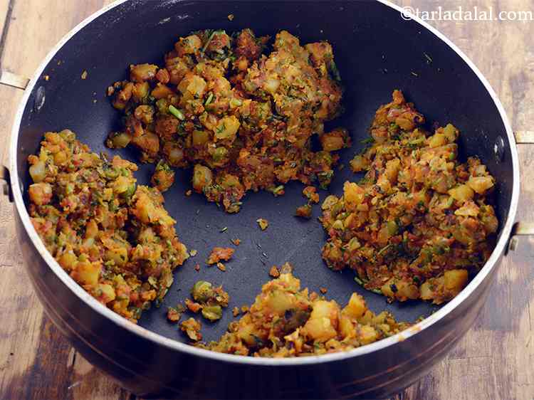 Step 14 – Keep aside to cool slightly. Divide it into 4 equal portions.