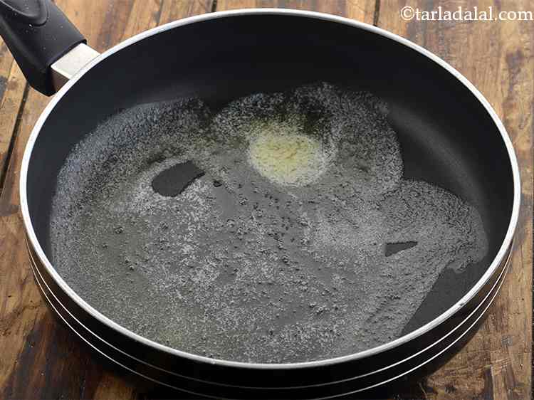 Step 28 – For the <strong>salad for veggie burger</strong>, in a broad non-stick pan add the butter and …