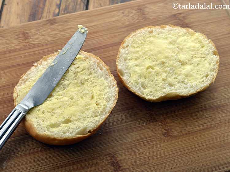 Step 38 – Apply &frac12; tsp of butter on the insides of each half of the burger bun.