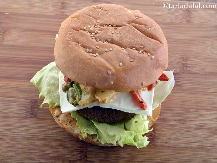 Step 46 – Cover with an upper half of the bun with the buttered&ndash;spread side facing down.