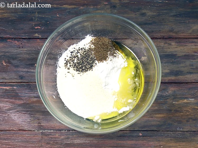 स्टेप 9 – २ टेबल-स्पून गरम घी डालें। आटा में किसी भी प्रकार …