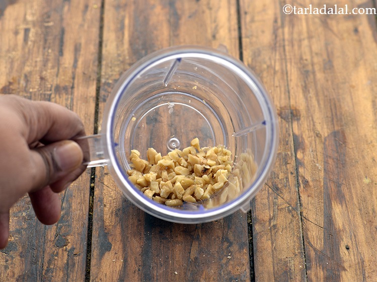 Step 10 – Transfer the walnuts in to a mixer jar.&nbsp;