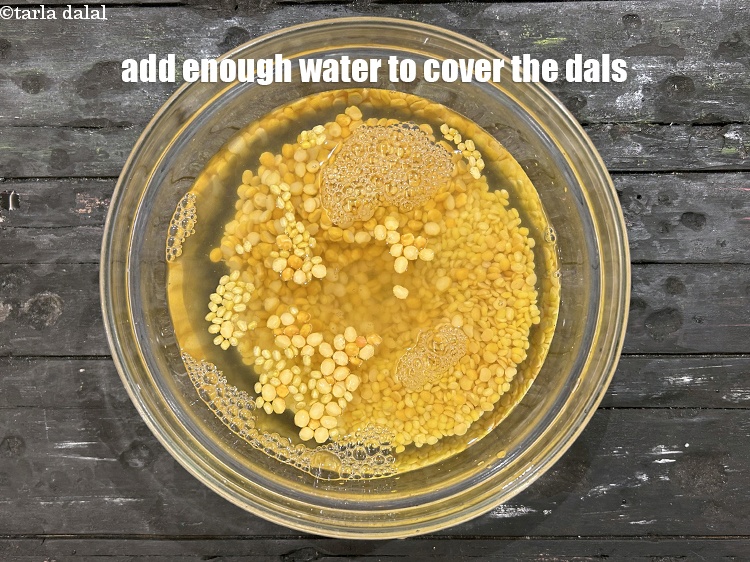 Step 6 – Add enough water to cover the dals.