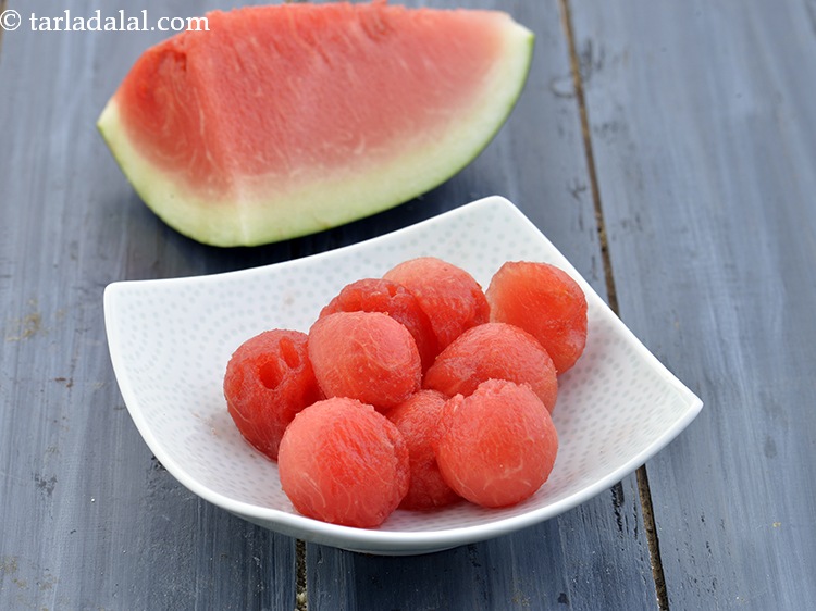 Step 11 – Then put 7 <a href="https://www.tarladalal.com/glossary-watermelon-balls-37i">watermelon (tarbuj) balls</a> in each glass.