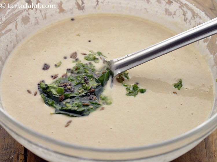 Step 19 – Pour this tempering over the batter and mix well. To enhance the flavour, you can …