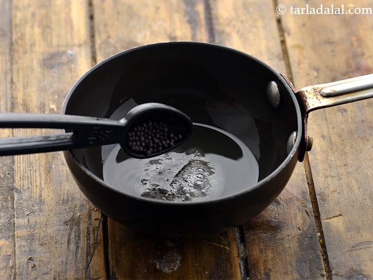 Step 15 – When the oil is hot, add mustard seeds.