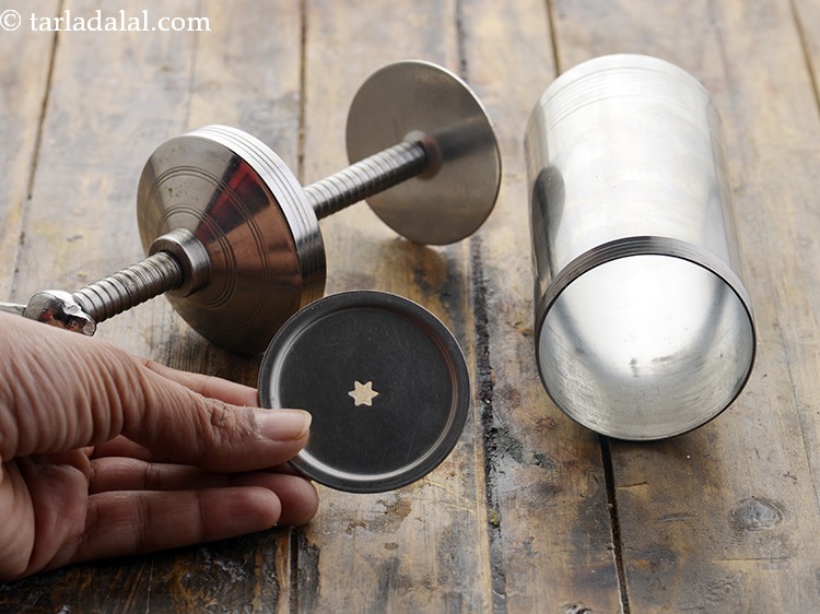 Step 25 – Take a chakli press and attach a star nozzle to it.&nbsp;
