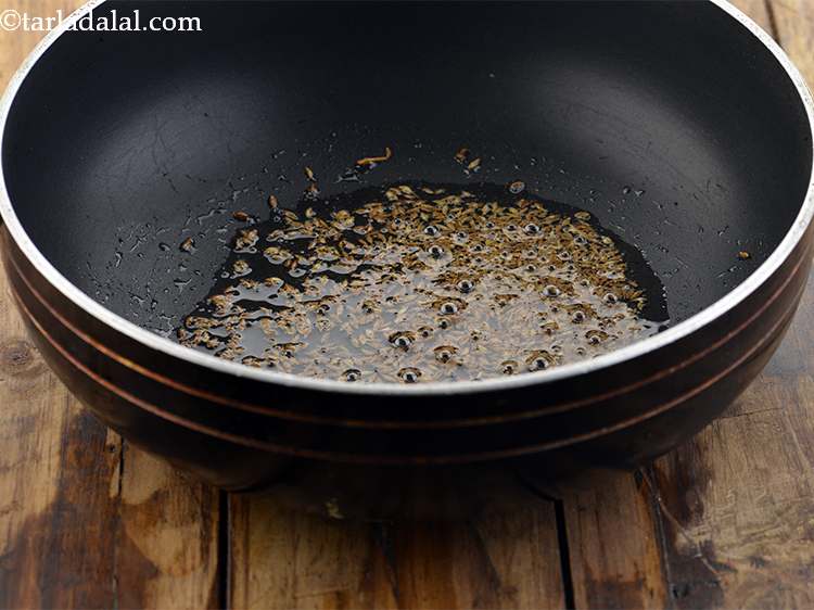 Step 2 – Once the oil is hot, add the cumin seeds.