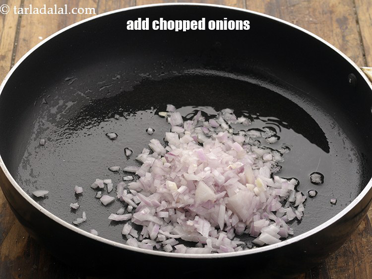 Step 7 – Once the oil is hot, add the onions.