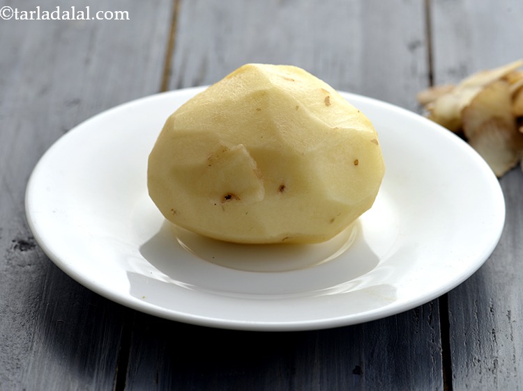 Step 12 – Peel the potatoes with a peeler and discard the peels.&nbsp;