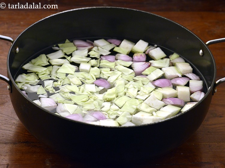 Step 25 – Add 1/4 cup&nbsp;roughly&nbsp;<a href="https://www.tarladalal.com/glossary-chopped-cabbage-781i">chopped cabbage</a>.