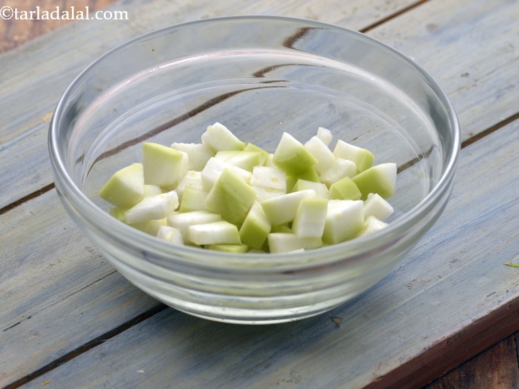 Step 22 – Add 5 tbsp&nbsp;<a href="https://www.tarladalal.com/glossary-chopped-bottle-gourd-401i">chopped bottle gourd (doodhi / lauki)</a>.