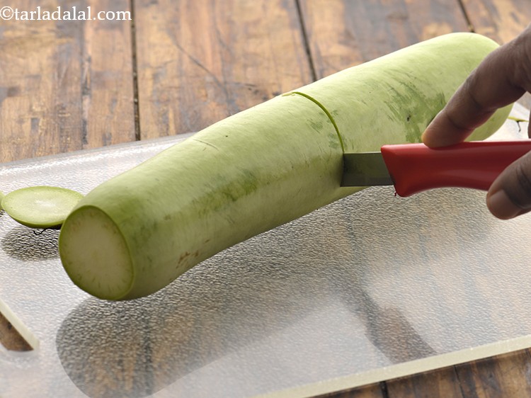 Step 6 – Cut the bottle gourd horizontally into 2 parts using a sterilized knife.