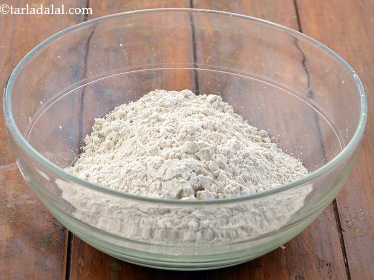 Step 3 – To make the <strong>Gujarati Bhakri</strong> recipe <strong>(Kathiyawadi Bhakri, Gujarati Style Biscuit Bhakri)</strong>, in a deep …