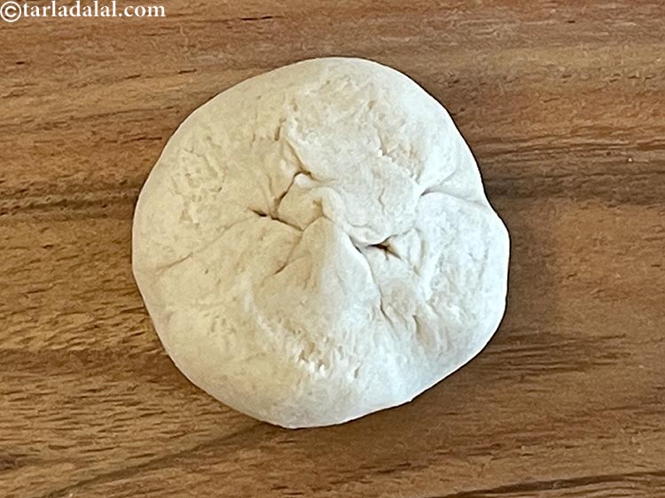 Step 14 – Pinch the pouch shape and roll into a smooth round shape with your palms.