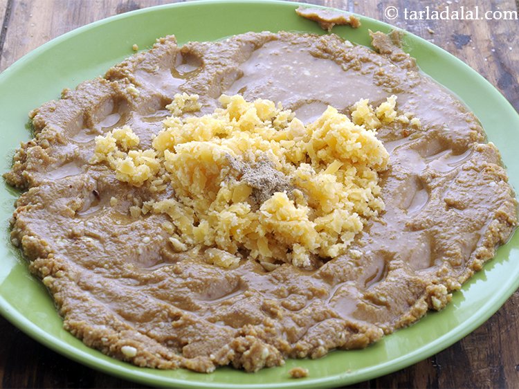 Step 11 – Add cardamom powder. You can also add roasted gaund, sesame seeds, khus khus, kopra, etc …