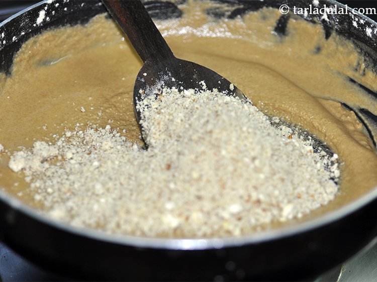 Step 7 – Switch off the flame, add the nuts. We have used almonds, cashew nuts, and pistachios …