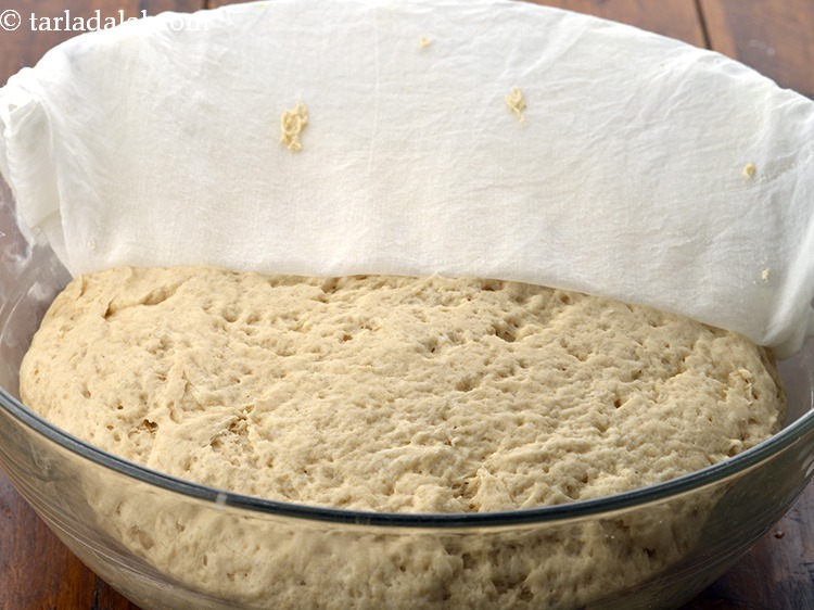 Step 25 – Transfer the dough into a greased deep bowl, cover it with a damp muslin cloth …