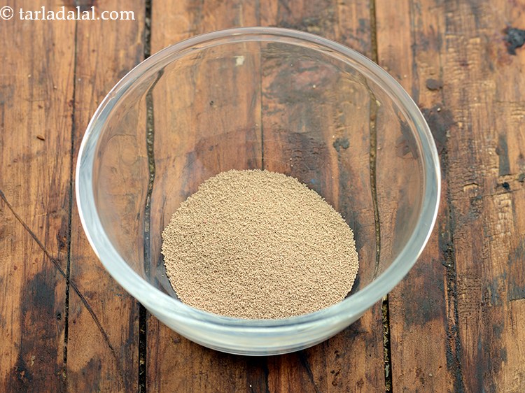 Step 11 – To make the dough for <strong>whole wheat masala bread rolls</strong>, in a small bowl, take …