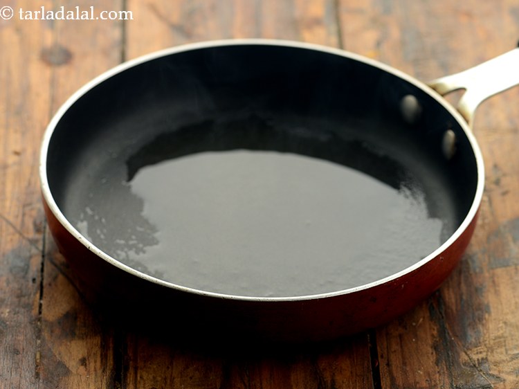 Step 2 – To make <strong>masala for whole wheat masala bread rolls</strong>, heat the oil in a small …