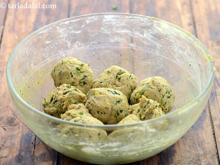 Step 26 – Lightly punch down the dough and divide the masala dinner rolls dough into 9 equal …